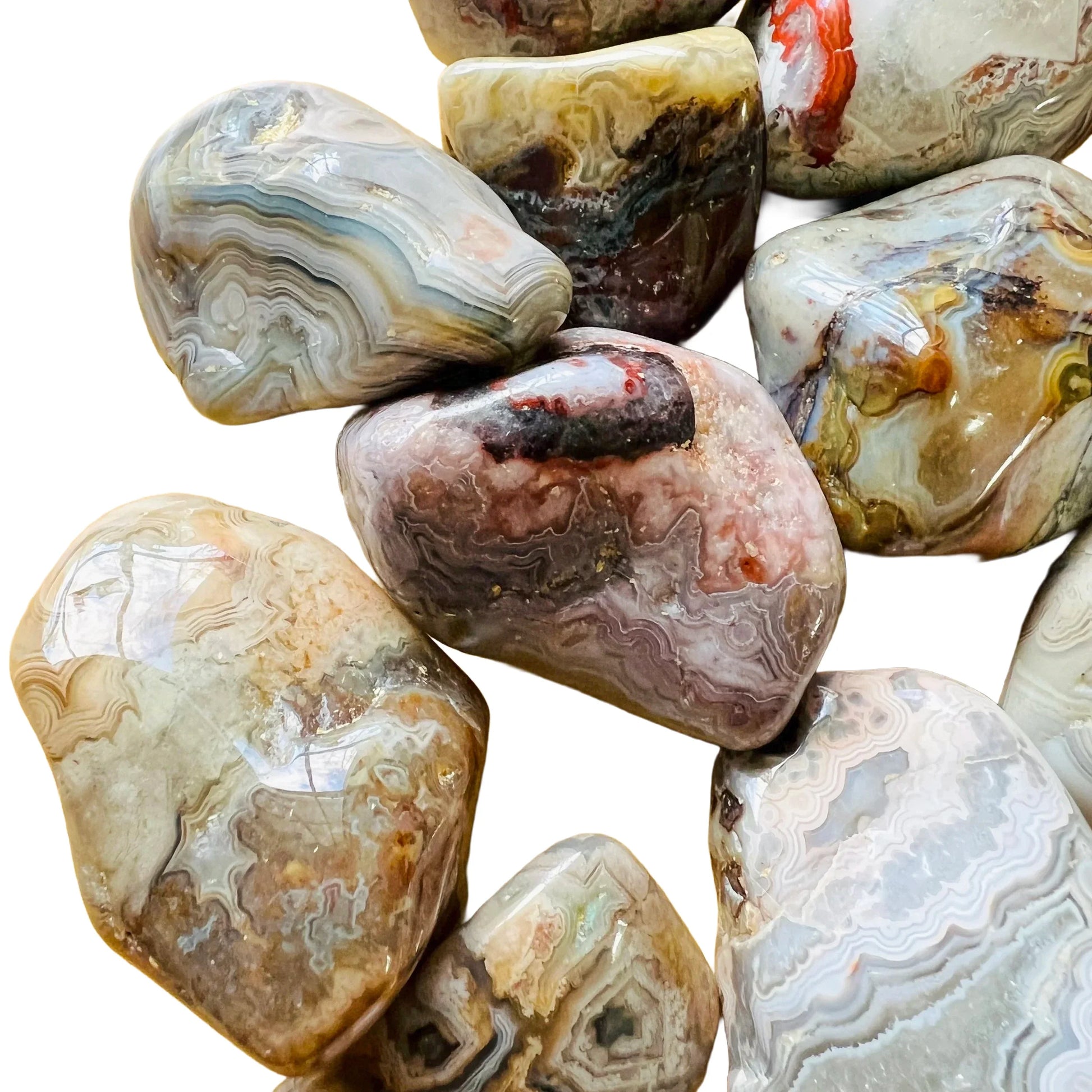 Bird's-eye view of Crazy Lace Agate tumbled stone, often kept for Energy, Mexico-sourced.