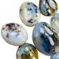 Profile shot of white Dendritic Agate palm stone, showing natural inclusions, linked to Grounding and Healing.