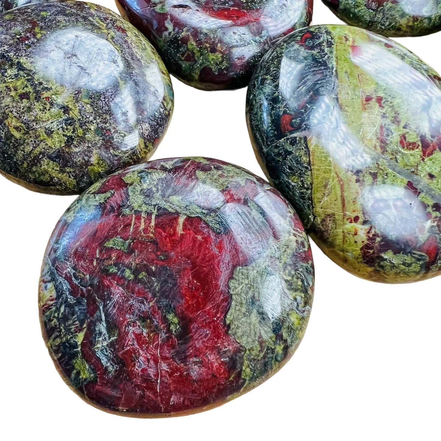 Color detail of Grade AA green Dragon Bloodstone palm stone, hand-selected from Limpopo, South Africa, drawn on for Confidence.