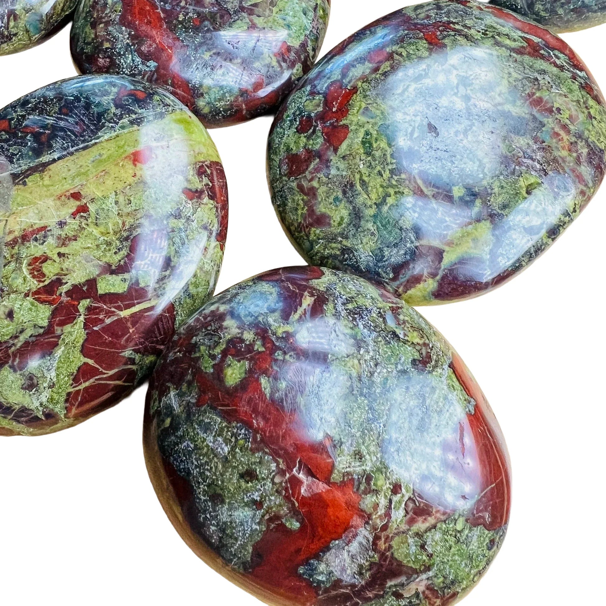 Overhead view of Dragon Bloodstone palm stone, hand-selected from Limpopo, South Africa, linked to Confidence.