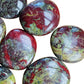 Opposite side of Grade AA Dragon Bloodstone palm stone, sourced from South Africa.