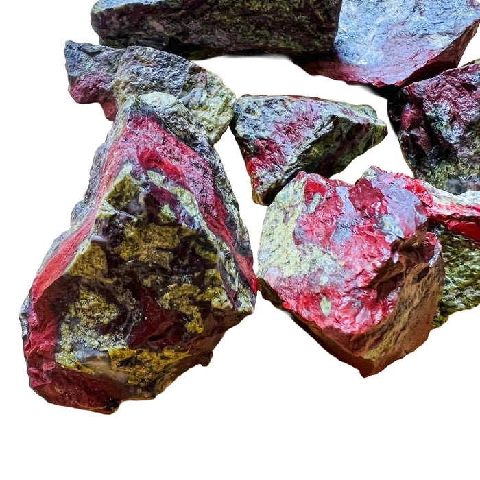 Macro view of Grade AA Dragon Bloodstone raw stone, kept near for Confidence and Energy.