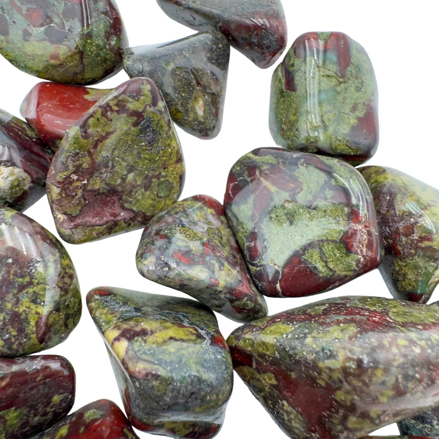 Size comparison with a Dragon Bloodstone tumbled stone for Confidence and Energy.