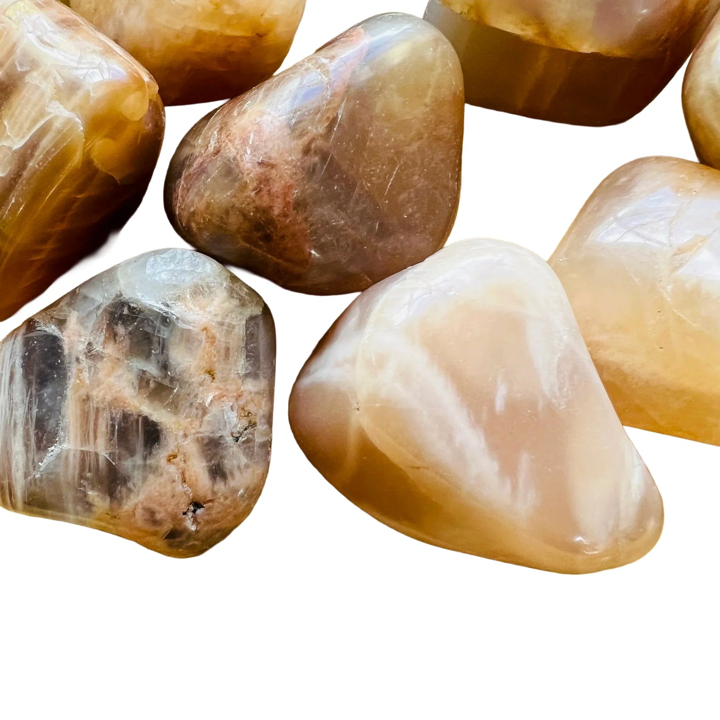 Side-on view of Grade AA Earth Moonstone tumbled stone, showing translucent edges.