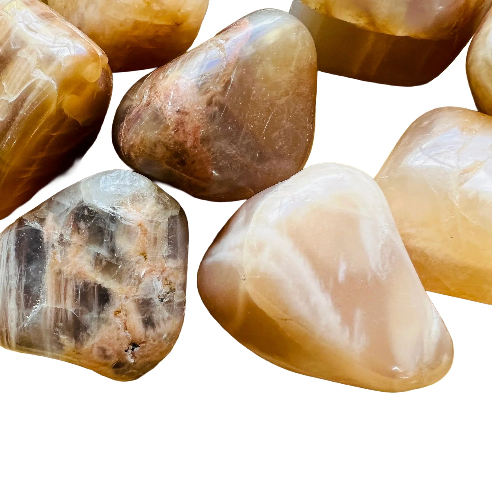 Side-on view of Grade AA Earth Moonstone tumbled stone, showing translucent edges.
