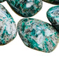 Side-on view of green Emerald palm stone, showing subtle veining.