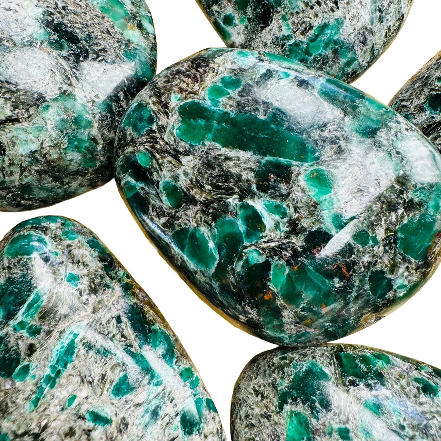 Grade aa emerald palm stone held in hand for size reference