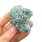 Top view of green Emerald specimen, showing natural patina.