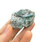 Grade aa emerald specimen held in hand for size reference