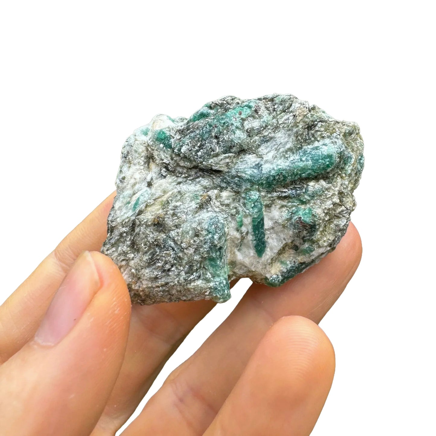 Grade aa emerald specimen held in hand for size reference