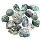 Natural light view of one Emerald raw stone for scale, sourced from Brazil.