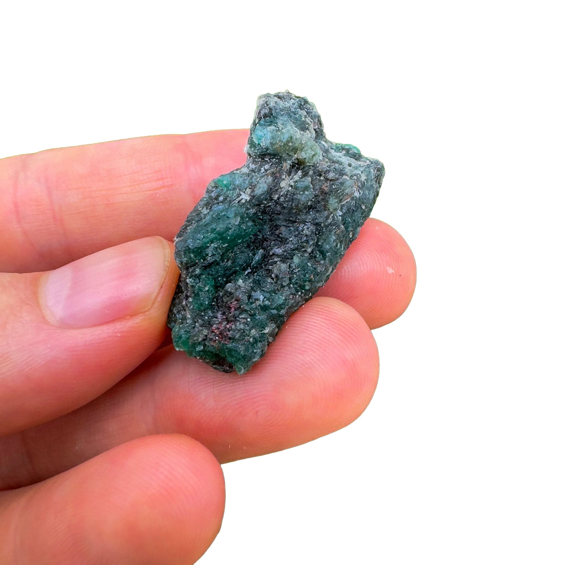 Styled with natural light Emerald raw crystal, from Midlands Province, Zimbabwe, often kept for Love, shown for proportion against the hand.