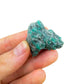 Back view of Grade AA Emerald raw showing natural surface