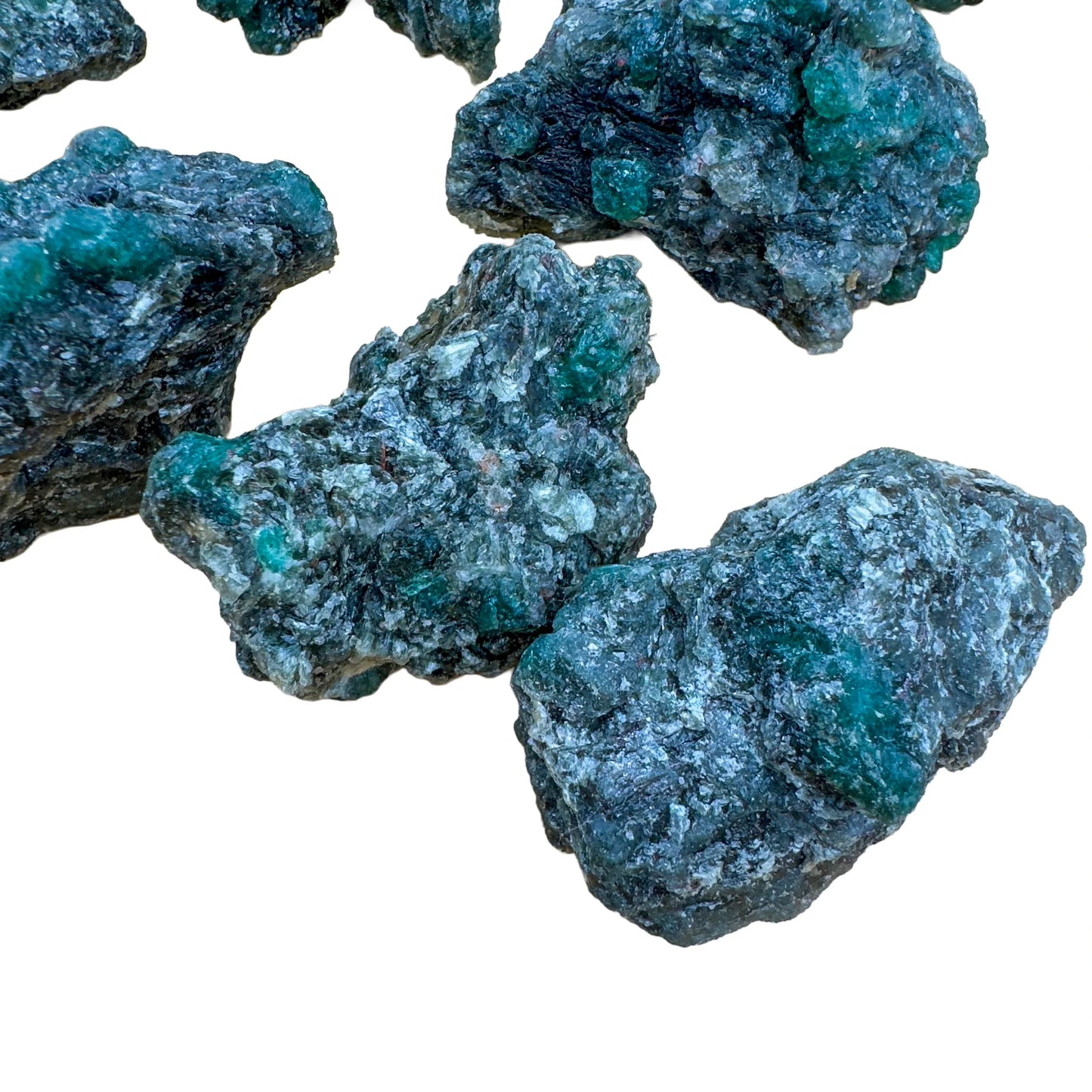 Lateral view of Grade AA Emerald raw stone, Zimbabwe-sourced.