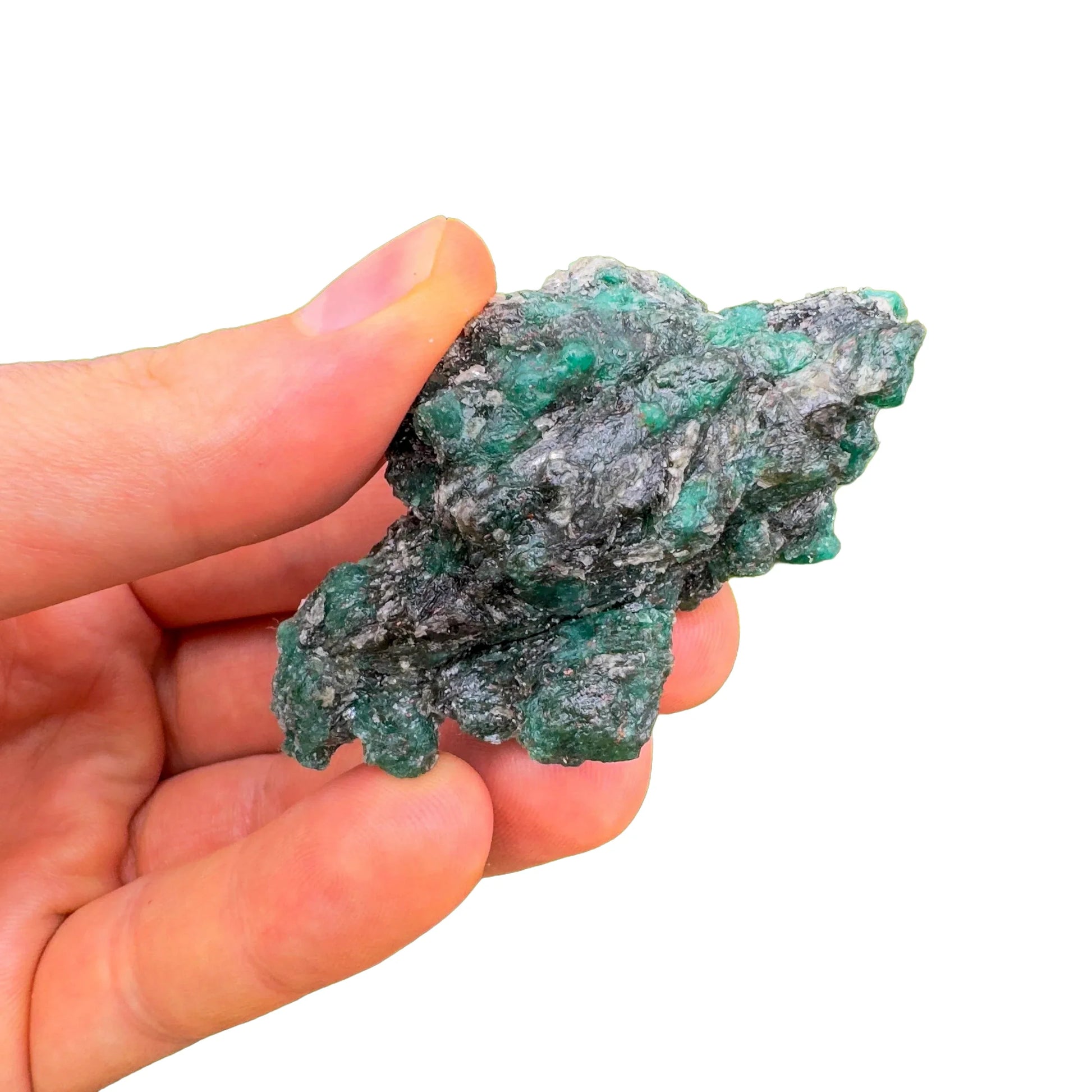 Hand-held view of one Emerald raw stone for scale, Zimbabwe-sourced, from Zimbabwe.