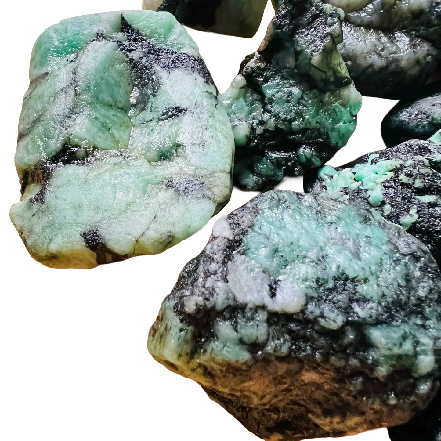 Lifestyle context of Emerald raw crystal, captured in soft, even lighting.