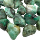 Side angle of Emerald tumbled stone, showing natural inclusions.