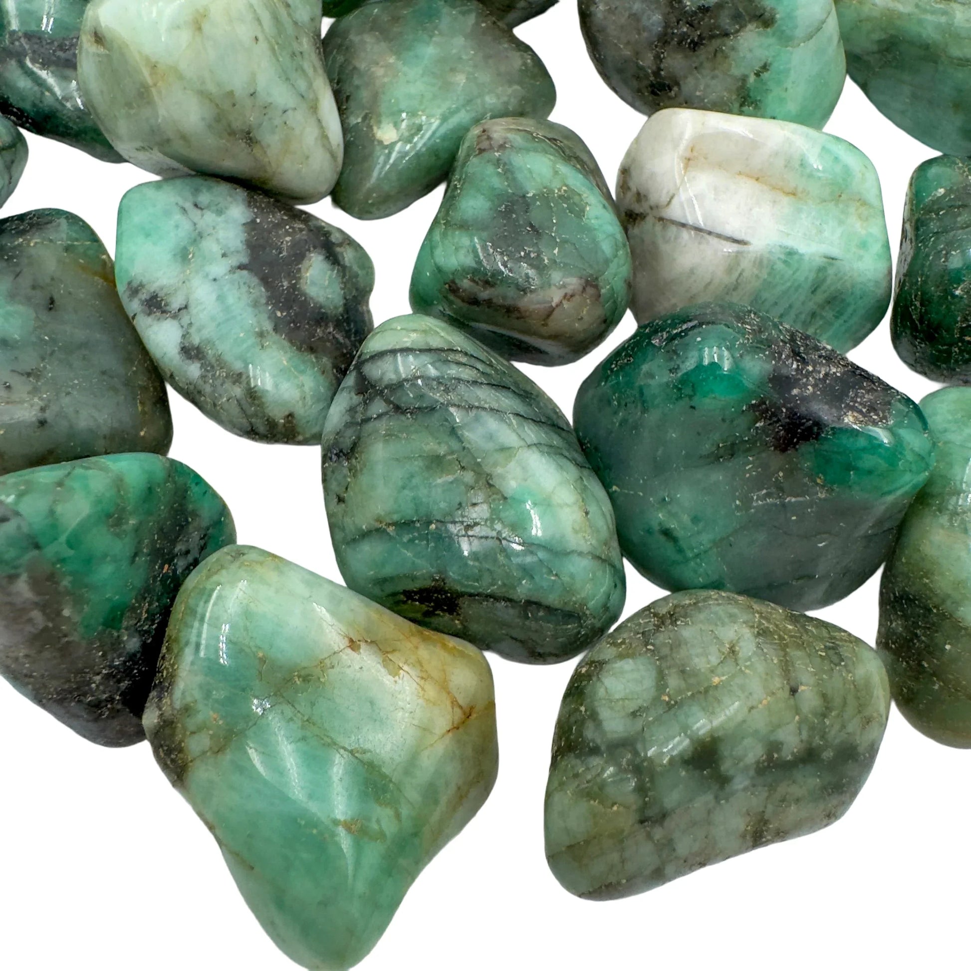 Side angle of Emerald tumbled stone, showing natural inclusions.