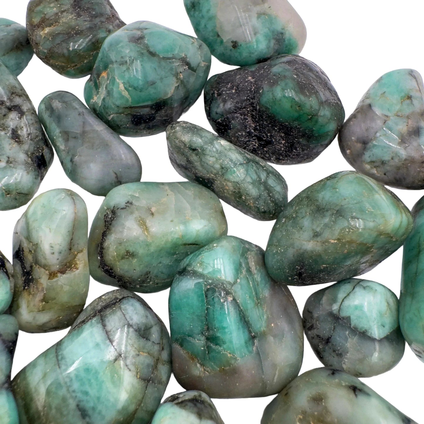 Scale reference of one Emerald tumbled stone for scale, from Bahia, Brazil.