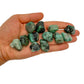 In context of an Emerald tumbled stone, from Bahia, Brazil, shown for size reference.