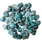 Back view of Grade AA Emerald tumbled stone showing natural surface