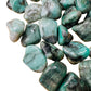 Detail shot of Grade AA Emerald tumbled stone under natural light