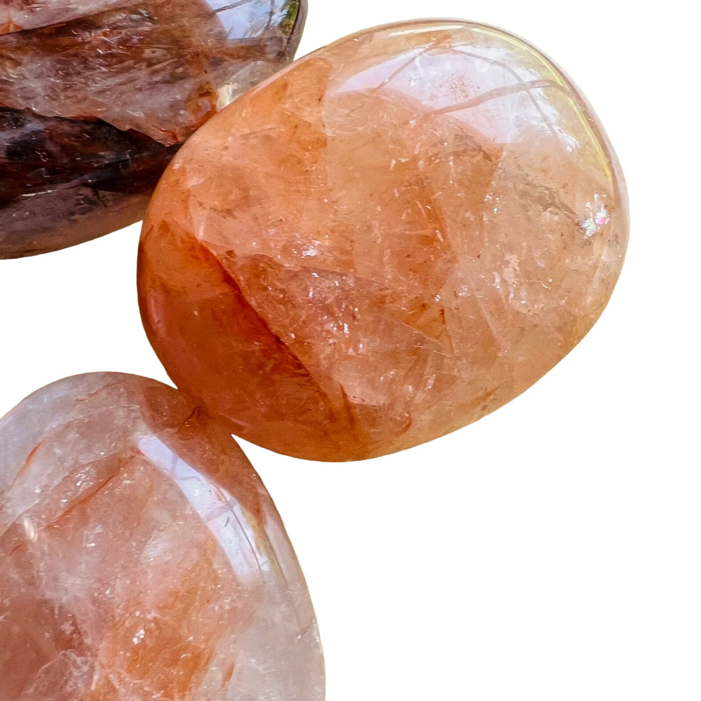 Top-side view of Fire Quartz palm stone, to support Grounding and Confidence.