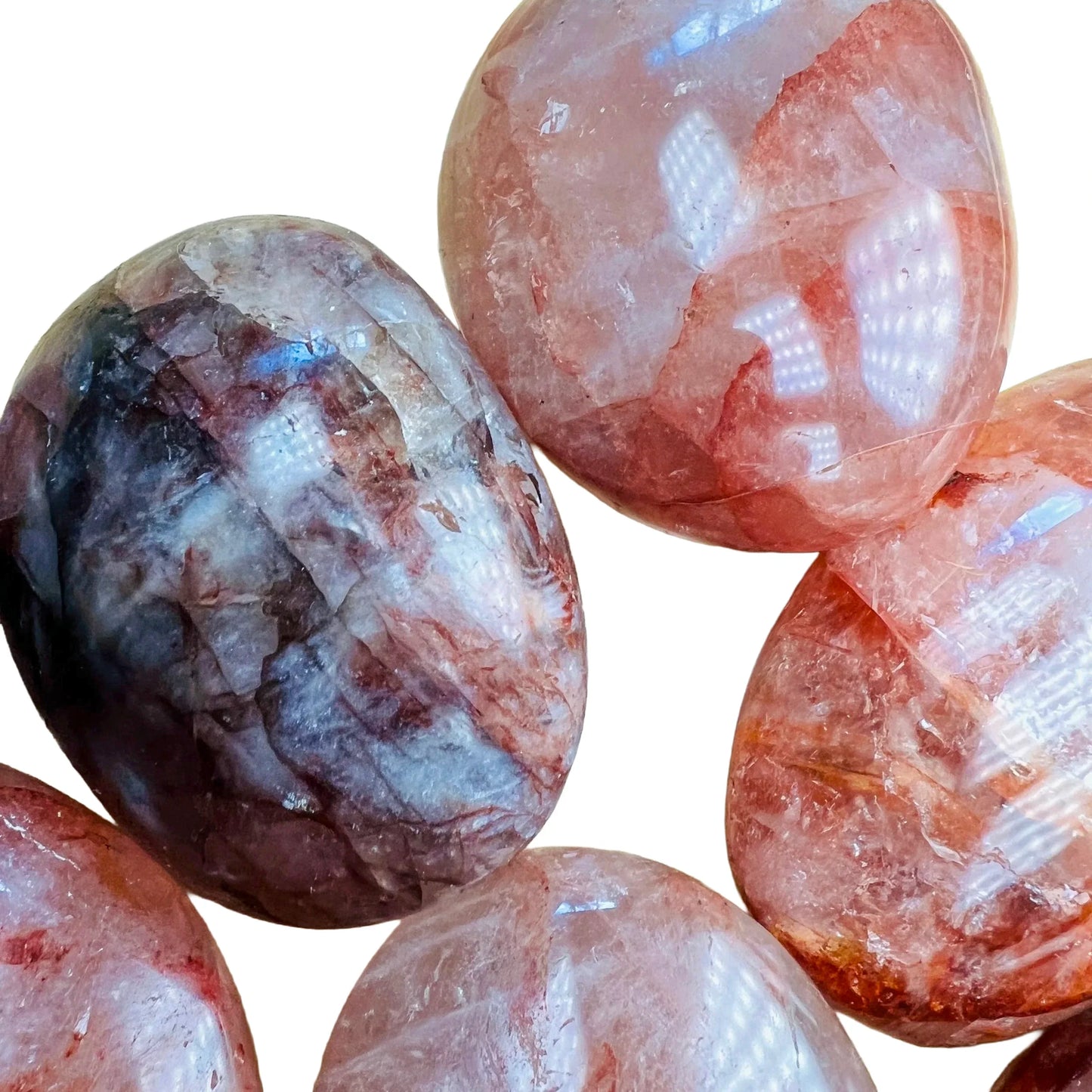 Detail shot of Grade AA Fire Quartz palm stone under natural light