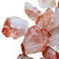 Texture-level view of red Fire Quartz raw stone, kept near for Grounding and Confidence, from Madagascar.