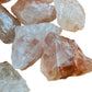 Bottom side of Fire Quartz raw stone, showing natural color depth.