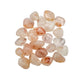 Up-close view of Grade AA Fire Quartz tumbled stone, showing natural sheen, carried for Grounding and Confidence.