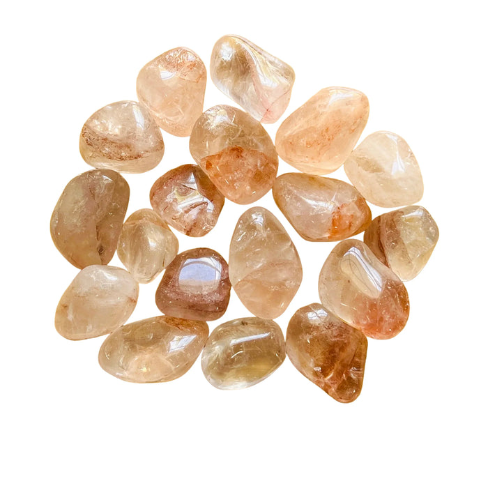 Detail shot of Grade AA Fire Quartz tumbled stone under natural light