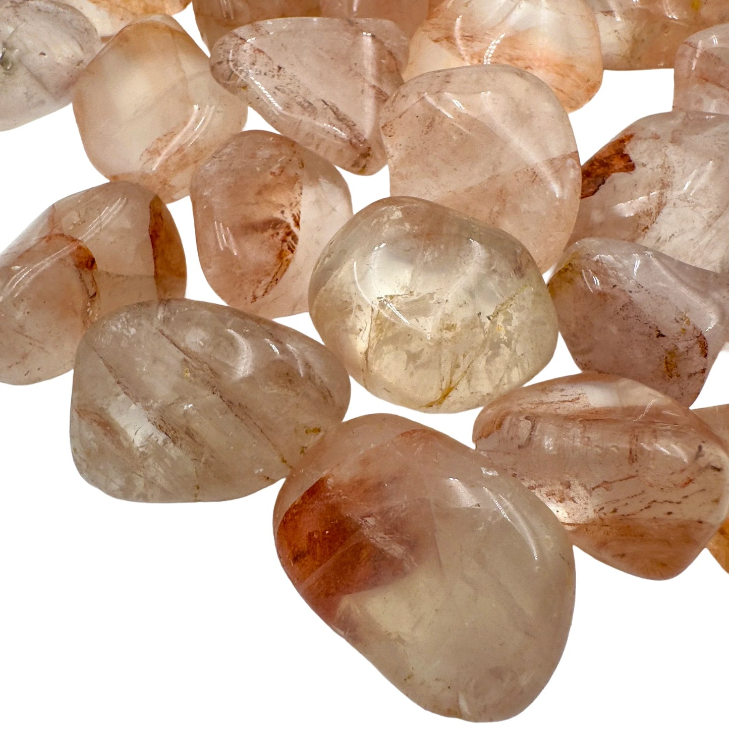 Edge view of Fire Quartz tumbled stone, kept near for Grounding, from Madagascar.