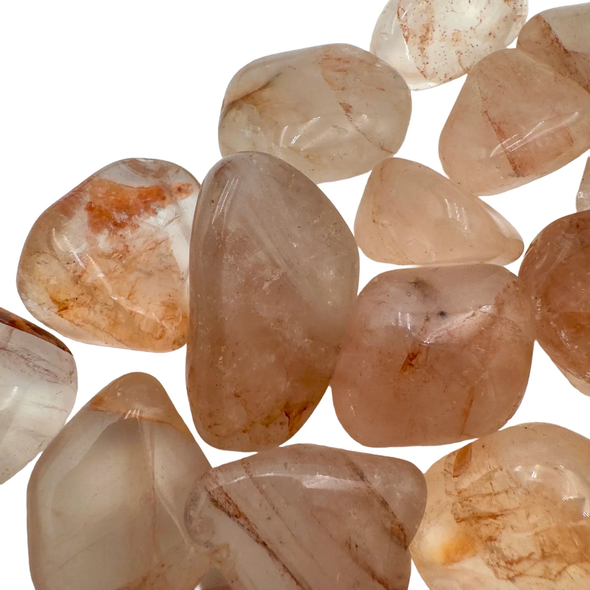 Back view of Fire Quartz tumbled stone, hand-selected from Alaotra-Mangoro, Madagascar, kept close for Grounding and Confidence.