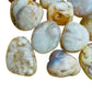 Side angle of Flower Agate tumbled stone, showing characteristic finish, sourced from Madagascar.