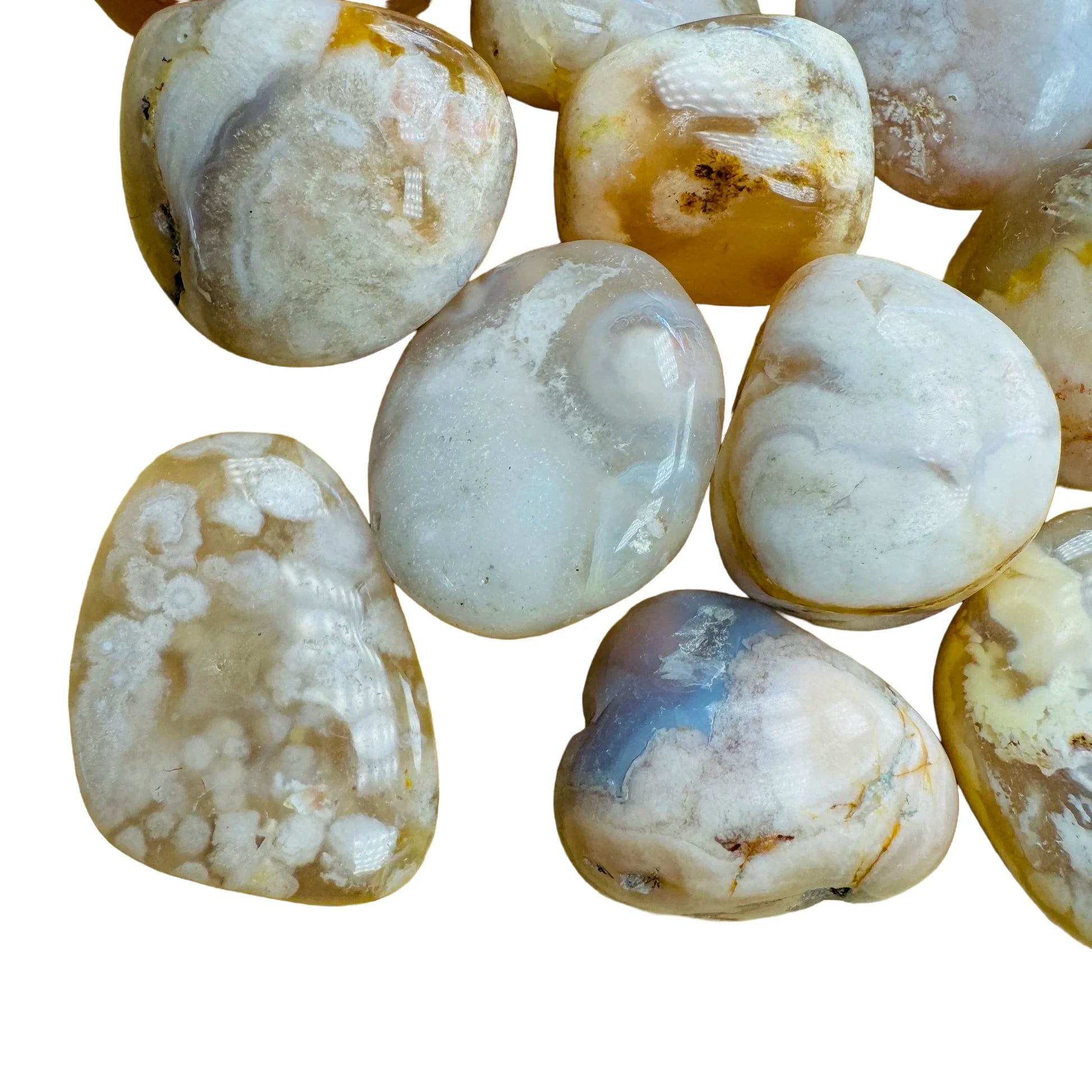 Side angle of Flower Agate tumbled stone, showing characteristic finish, sourced from Madagascar.