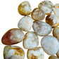 Top-down shot of Flower Agate tumbled stone, carried for Love.