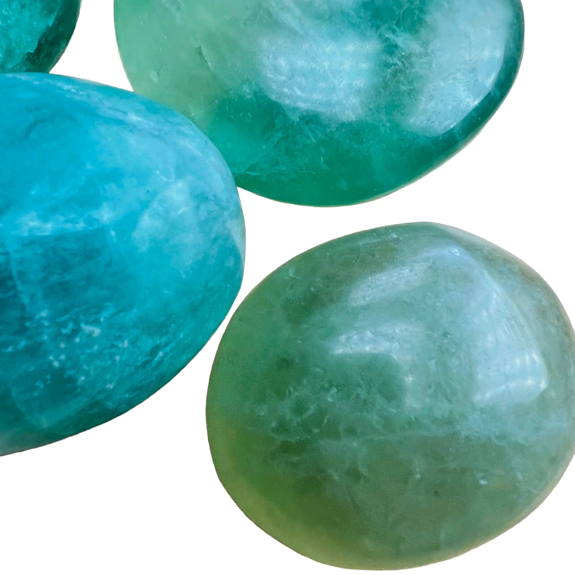Side profile of Fluorite palm stone, Madagascar-sourced, traditionally used for Focus and Meditation.