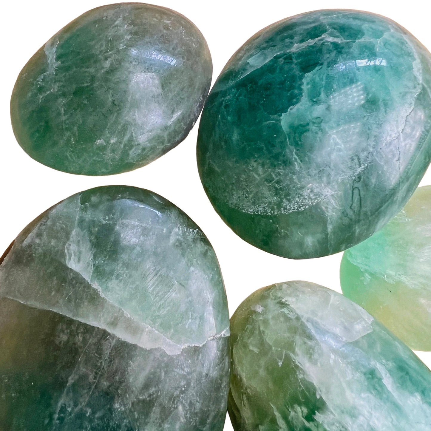 Top-side view of Fluorite palm stone, sourced from Amoron’i Mania, Madagascar, showing glassy finish.