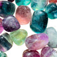 Grain detail of Grade AA Fluorite tumbled stone, often kept for Focus, showing characteristic color.
