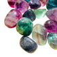 Side profile of purple Fluorite tumbled stone, turned to for Focus, showing glassy finish.