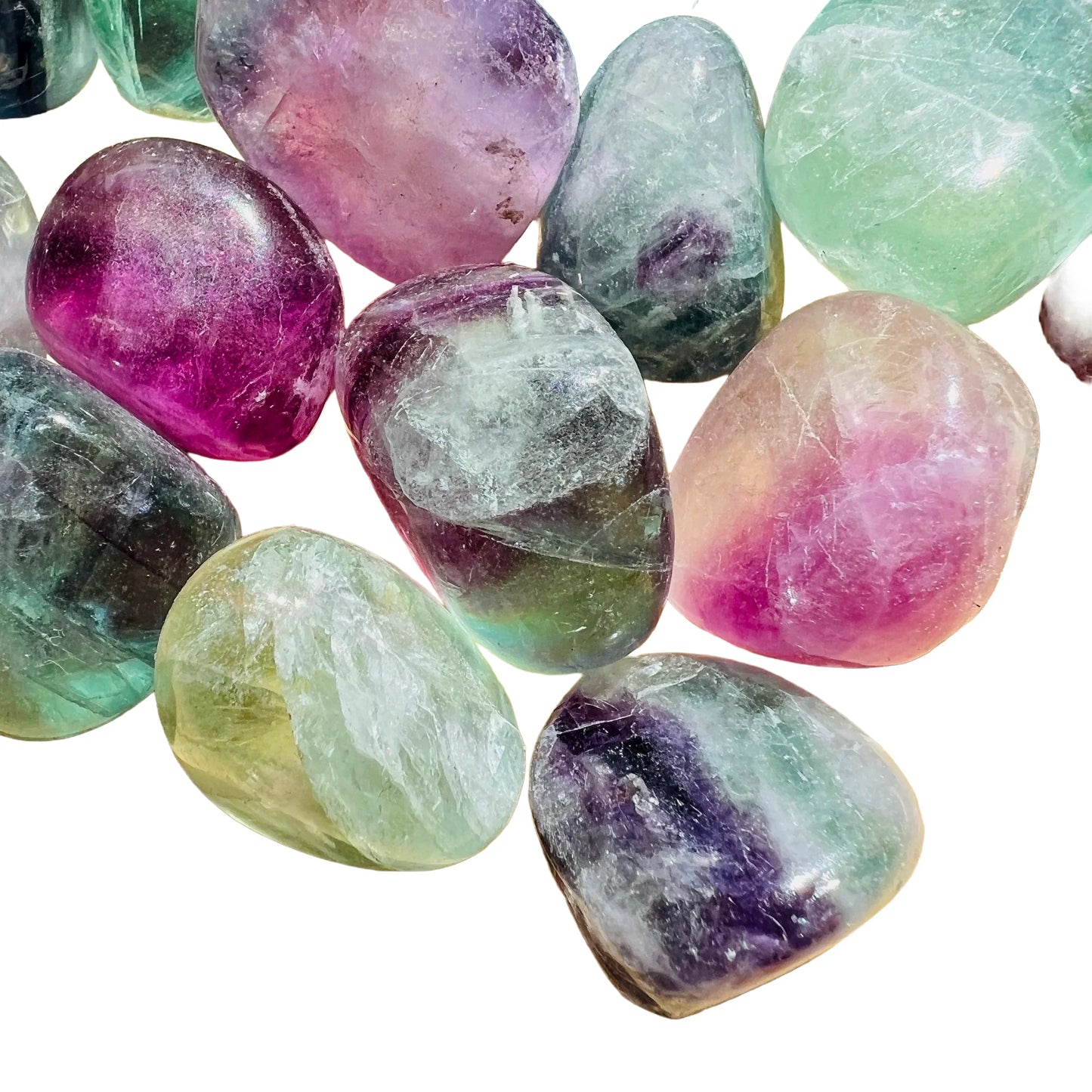 Bird's-eye view of Grade AA purple Fluorite tumbled stone, kept near for Focus and Meditation, showing natural inclusions.