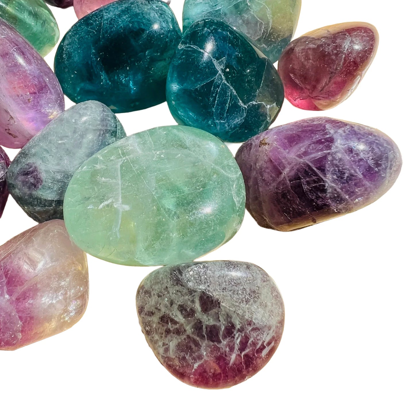 Alternate angle of Grade AA Fluorite tumbled stone, associated with Focus, showing subtle veining.