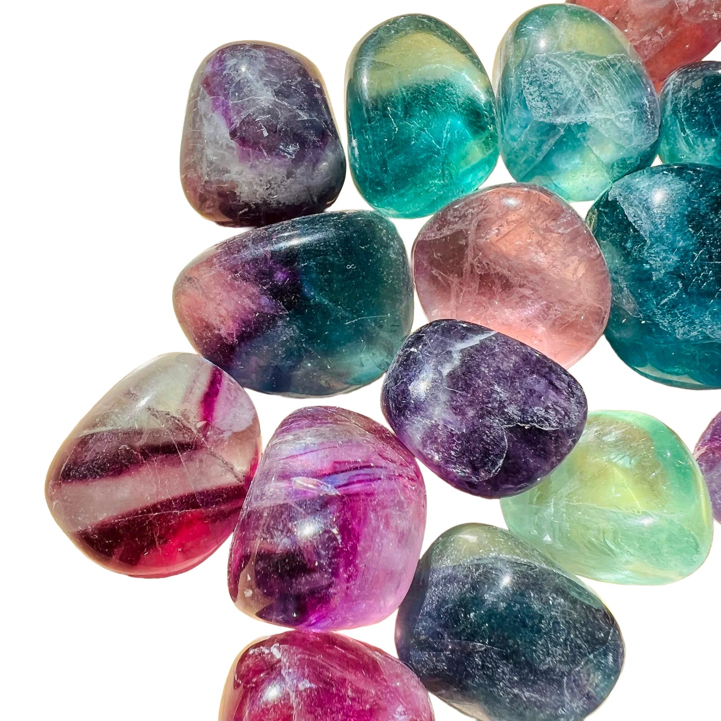 Hand-held view of one Fluorite tumbled stone for scale, hand-selected from Jiangxi, China.