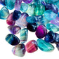 Looking down on Grade AAA Fluorite tumbled stone, often worked with for Focus, showing translucent edges.