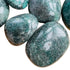 Looking down on Grade AA Fuchsite palm stone, showing natural sheen, from Madagascar.