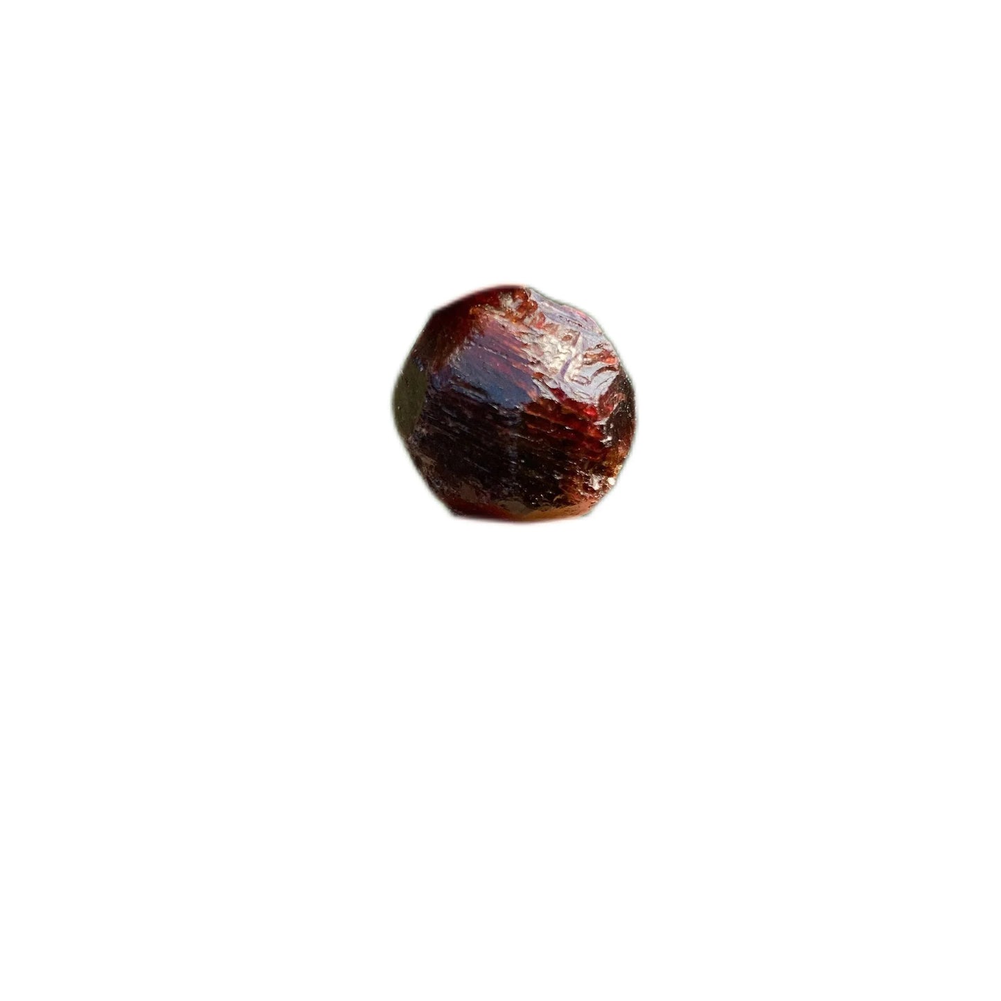 Overhead angle of Grade AA Garnet raw stone, from Minas Gerais, Brazil.