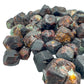 Side angle of Fuchsite raw stone, showing characteristic patterning.