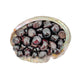Up-close view of Garnet tumbled stone, kept close for Energy, showing natural inclusions.