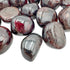 Sideways view of Garnet tumbled stone, showing soft luster, Malawi-sourced.